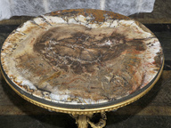 immagine di Tavolino con piano in legno pietrificato